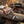 Fold-out camp utensil set from DM Merchandising with wooden handle and multiple tools, designed for outdoor picnics and camping.