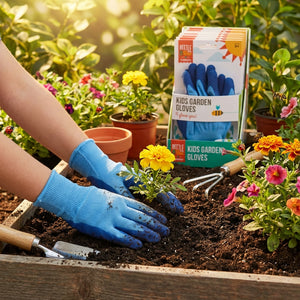 Child's hands in blue gloves planting yellow flowers in soil, surrounded by gardening tools.