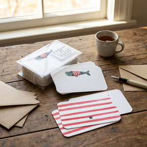 Whale-themed notecards from Little Notes® by E. Frances Paper, featuring playful whale illustrations on high-quality paper.