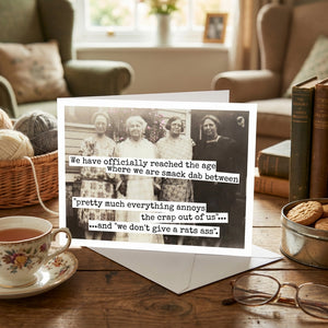 Birthday greeting card from Raven's Rest Studio with humorous "We Have Officially Reached The Age" message and colorful design.