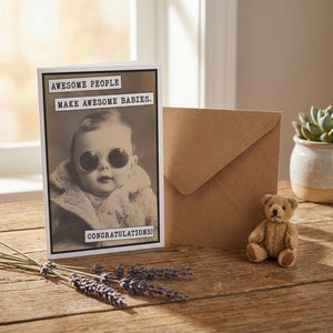 Greeting card featuring playful text "Awesome People Make Awesome Babies" by Katie Doodle, with colorful, cheerful design.