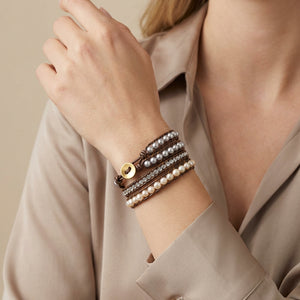 Two-tone freshwater pearl wrap bracelet with silver and gold accents from Free Spirit Shop, displayed on a neutral background.