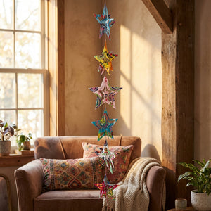 Large Suzani print star paper garland by Moksha Imports, featuring vibrant colors and intricate patterns for decorative use.