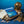 Diving book, vintage helmet, map, corals, diving fins, compass on a blue background.