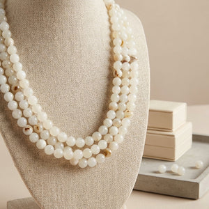 White onyx triple necklace by Nellie Pratt Artisan Jewelry featuring layered sterling silver chains and elegant gemstone accents.