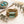 Turquoise glass and brass bracelet set from Nellie Pratt Artisan Jewelry featuring multiple layered bangles with intricate details.
