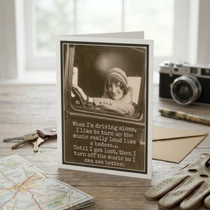 Greeting card from Raven's Rest Studio featuring the phrase "When I'm driving alone" with a scenic background and artistic design.