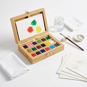 Watercolor set with 18 vibrant colors in a bamboo box by elseware unplug eco-kids, featuring artistic watercolor paints.
