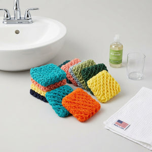 Set of Dot and Army cleaning scrubbies made in the USA with colorful, textured sponges for kitchen cleaning tasks.