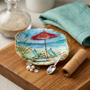 Handmade beach chairs with painted shells and umbrella, featuring vibrant, colorful designs for a stylish seaside setting.