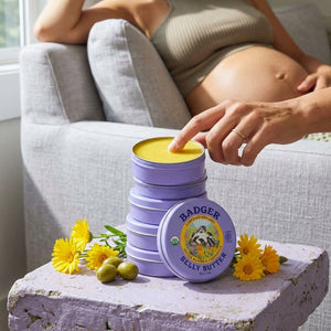 Organic Badger Belly Butter stretch mark cream for pregnant women, featuring natural ingredients in a jar.