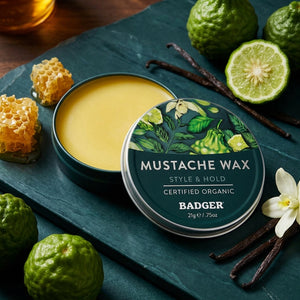 Badger Mustache Wax with medium hold, in a small tin, designed for styling and shaping mustaches.