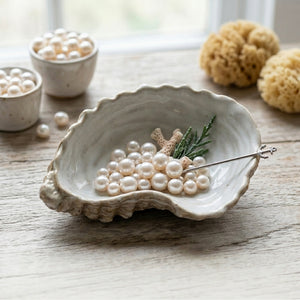 Stoneware shell dish serveware by CCOI, featuring a textured shell design, perfect for serving or decorative use.